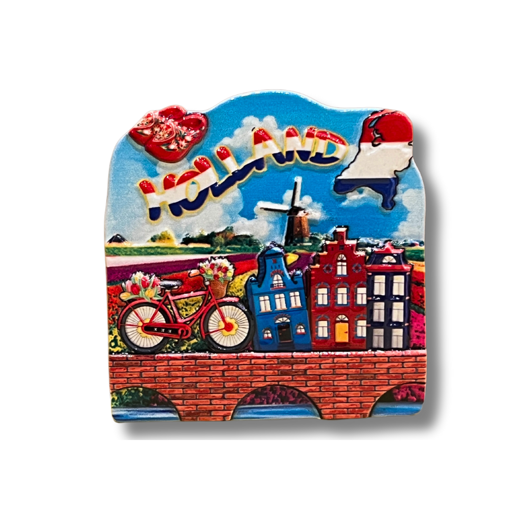 Zoek je een leuk en betaalbaar cadeau voor een vriend of geliefde? Koop dan een Nederlandse souvenir magneet! Onze magneet is gedecoreerd met een afbeelding van het Hollandse landschap, inclusief een molen. De magneet is sterk genoeg om foto's, papieren en andere dunne metalen objecten vast te houden.